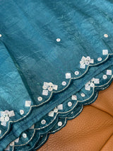 Vasundhara Fashions teal crush Russian silk saree featuring intricate scalloped edges with silver sequin embroidery.