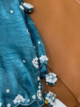 Vasundhara Fashions teal crush Russian silk saree featuring intricate silver sequin embroidery and decorative tassels