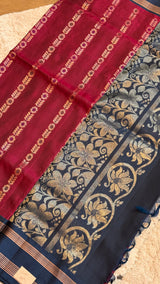 Vasundhara Fashions Uppada Pattu silk saree in deep red and navy blue with intricate gold zari floral borders