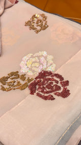 Vasundhara Fashions wine chiffon saree featuring intricate multi-colored floral sequin embroidery motifs