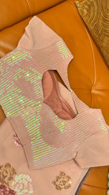 Vasundhara Fashions wine chiffon saree featuring intricate floral sequin embroidery and a matching sequin blouse.
