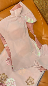 Vasundhara Fashions wine chiffon saree with matching blouse featuring intricate multi-colored floral sequin embroidery